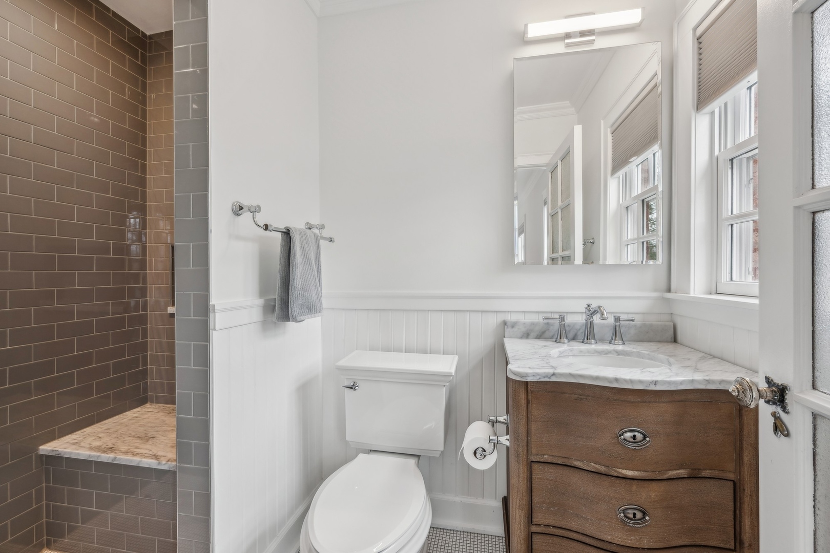 78 Robsart Road Kenilworth, IL 60043 - Photo 33 of 44 a bathroom with a granite countertop toilet sink and mirror