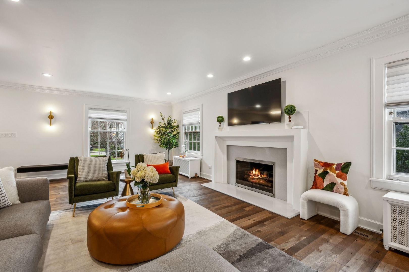 78 Robsart Road Kenilworth, IL 60043 - Photo 7 of 44 a living room with furniture a fireplace and flat screen tv