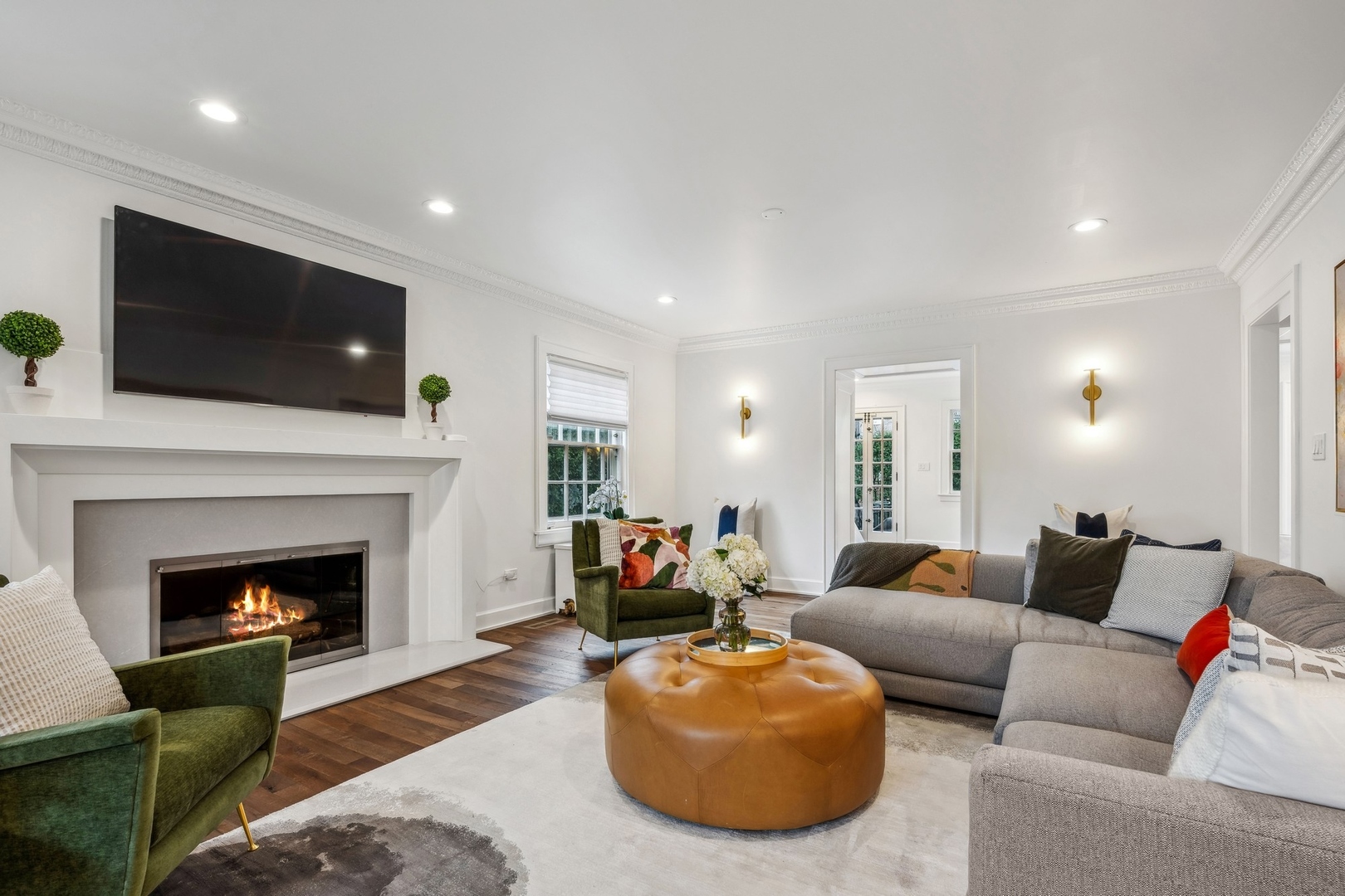 78 Robsart Road Kenilworth, IL 60043 - Photo 8 of 44 a living room with furniture a fireplace and flat screen tv