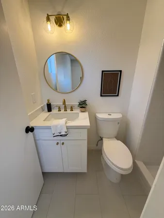 a bathroom with a toilet a sink and shower