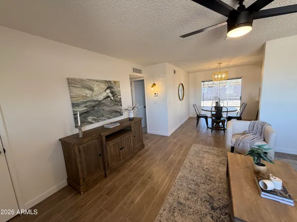 a view of a dining room with furniture window and wooden floor