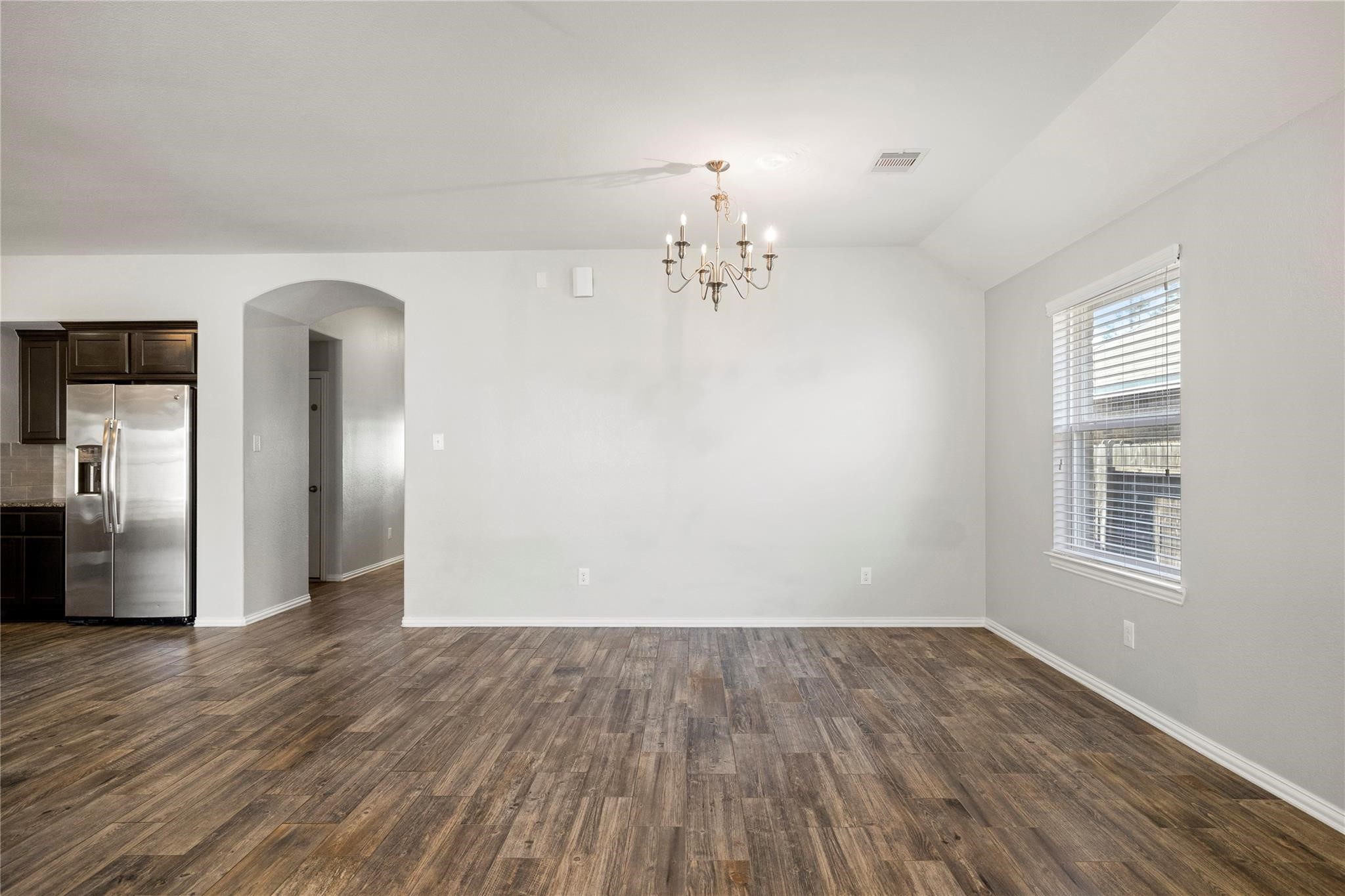 29507 Whitebrush Trace Drive Spring, TX 77386 - Photo 20 of 32 Dining area with chandelier and open access to living space.