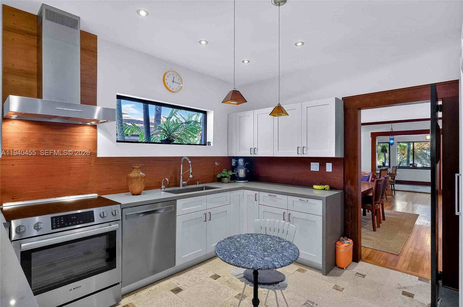 452 Southwest 21st Road Miami, FL 33129 - Photo 14 of 51 a kitchen with a sink cabinets and wooden floor