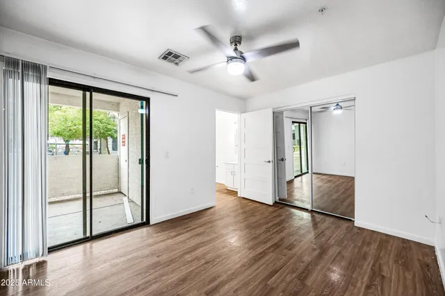 a view of living room kitchen with furniture and large window