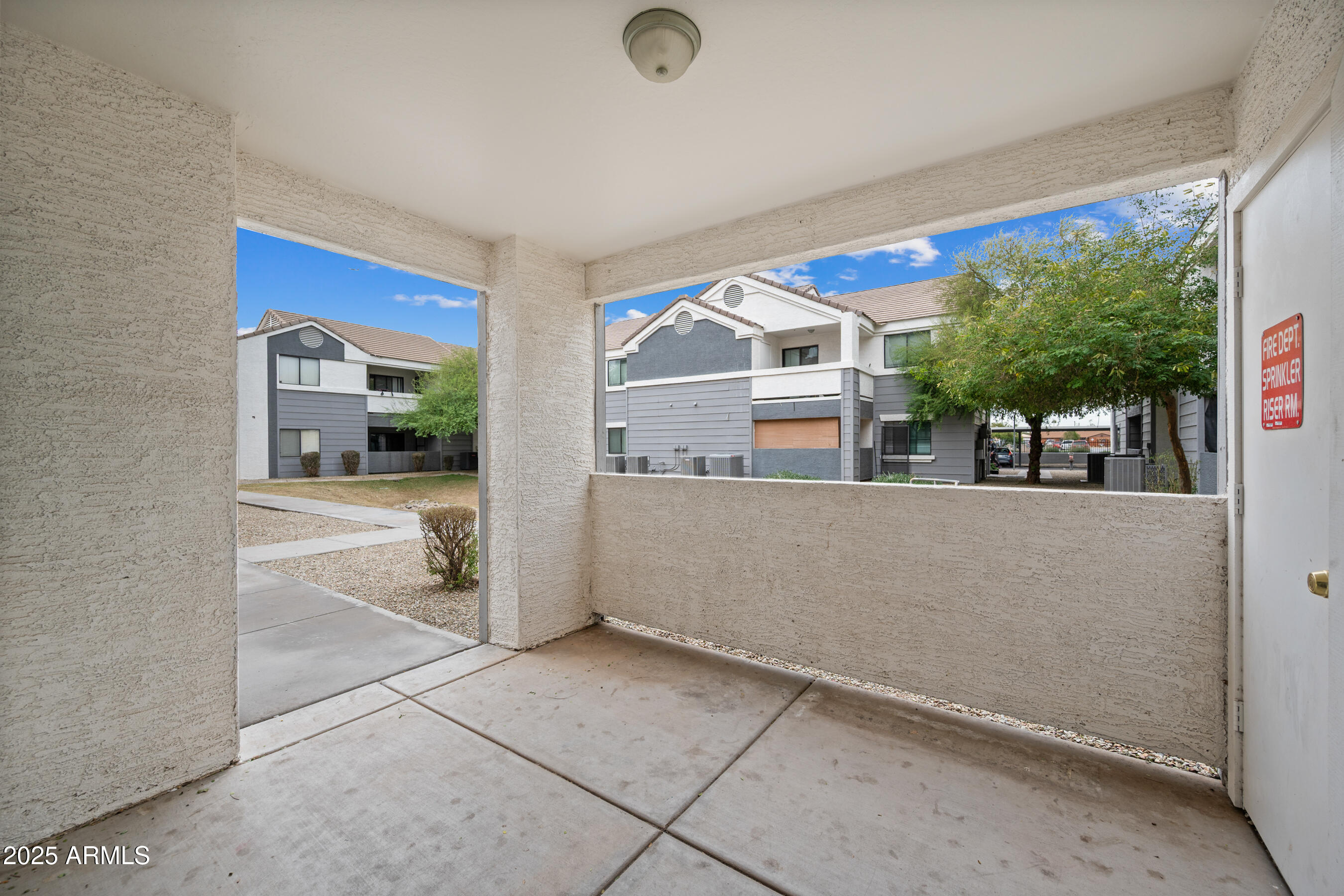 3065 North 67th Avenue, Unit 135 Phoenix, AZ 85033 - Photo 13 of 30 a view of living room kitchen with furniture and large window