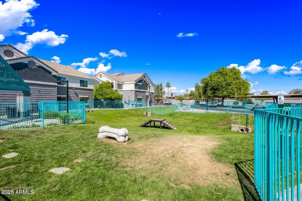 3065 North 67th Avenue, Unit 135 Phoenix, AZ 85033 - Photo 29 of 30 a view of a garden with a house in the background