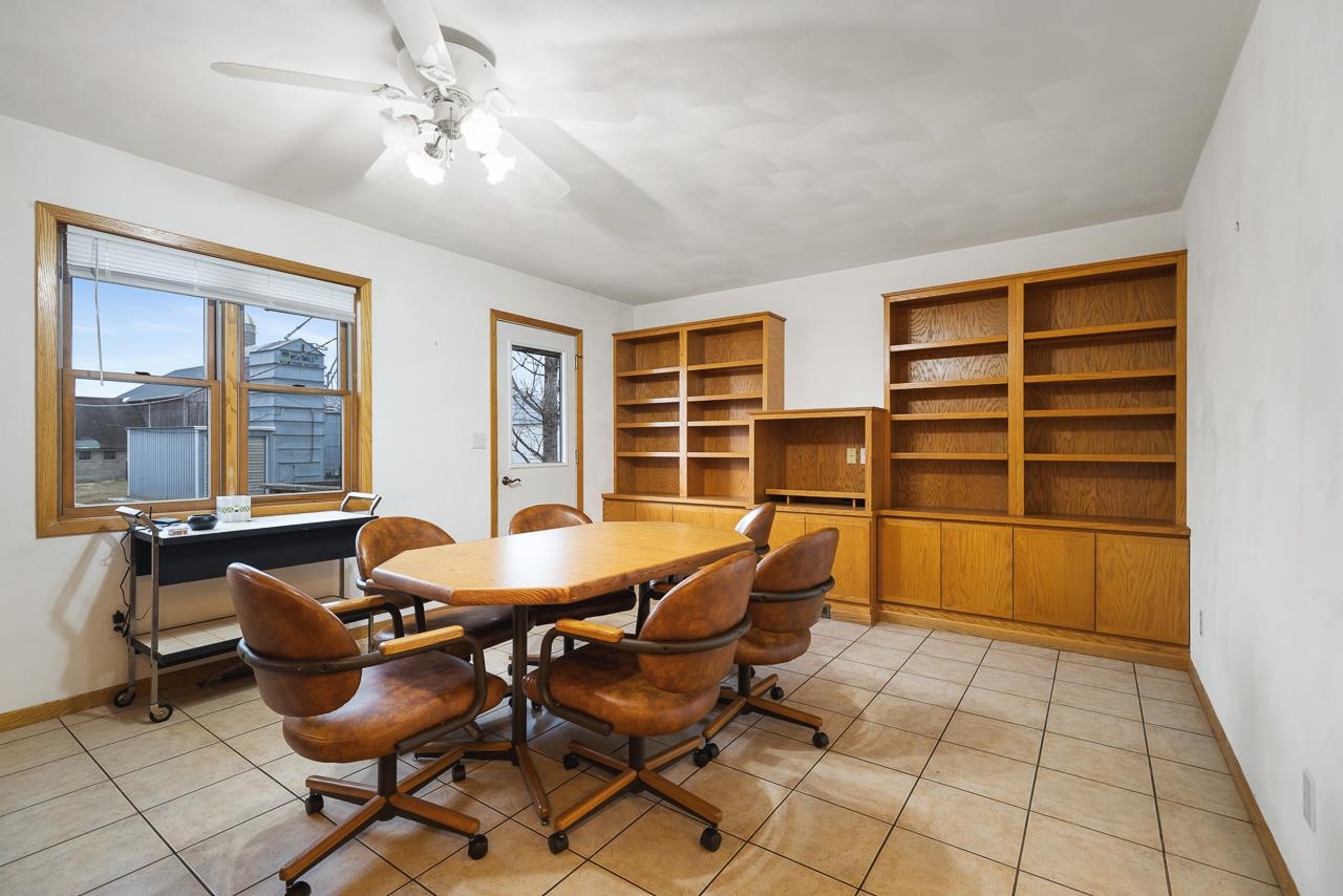 3178 North Berlin School Road Ridott, IL 61067 - Photo 12 of 47 a dining room with furniture and windows