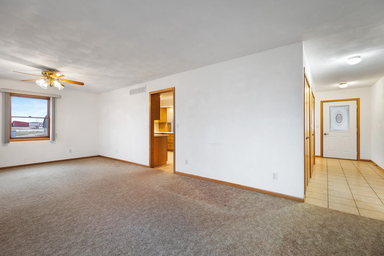 3178 North Berlin School Road Ridott, IL 61067 - Photo 17 of 47 an empty room with windows and closet