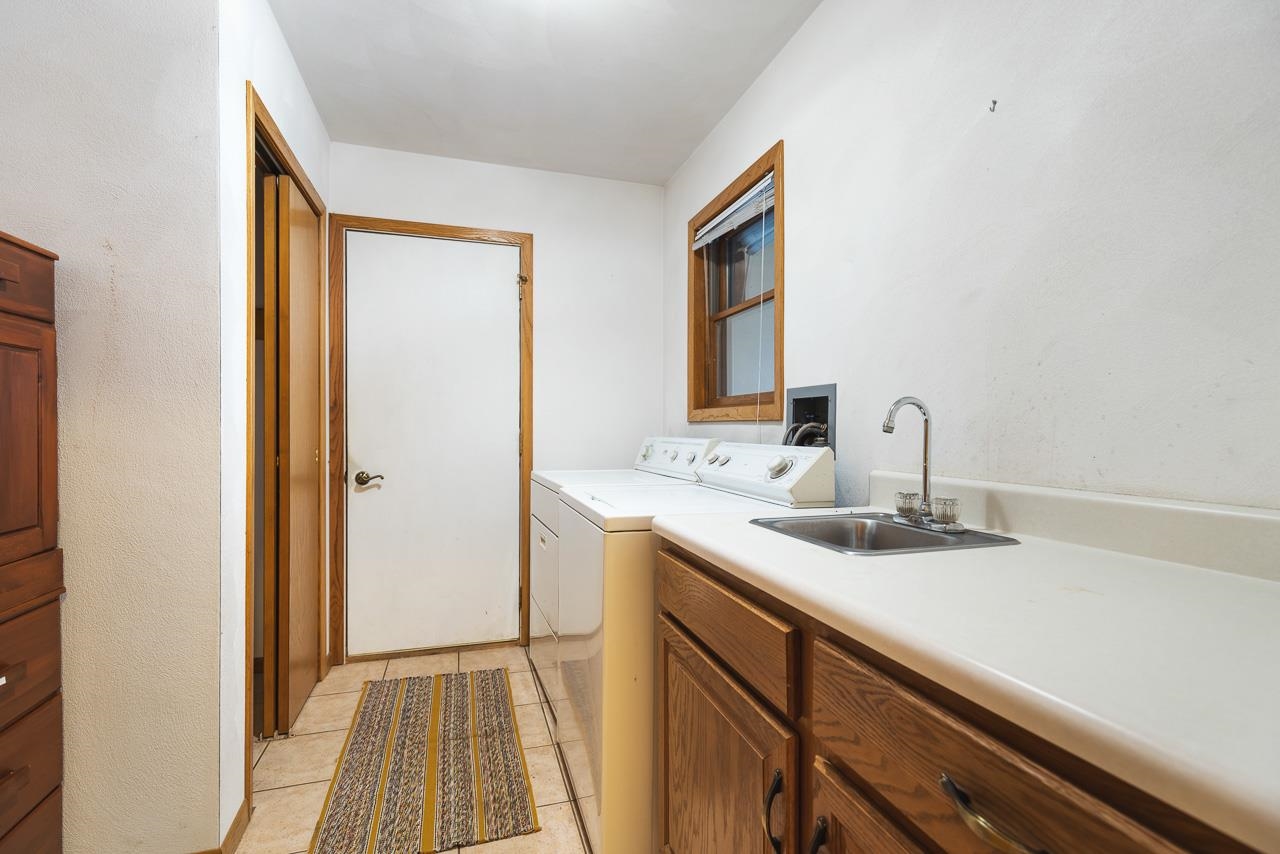 3178 North Berlin School Road Ridott, IL 61067 - Photo 27 of 47 a bathroom with a sink and a mirror
