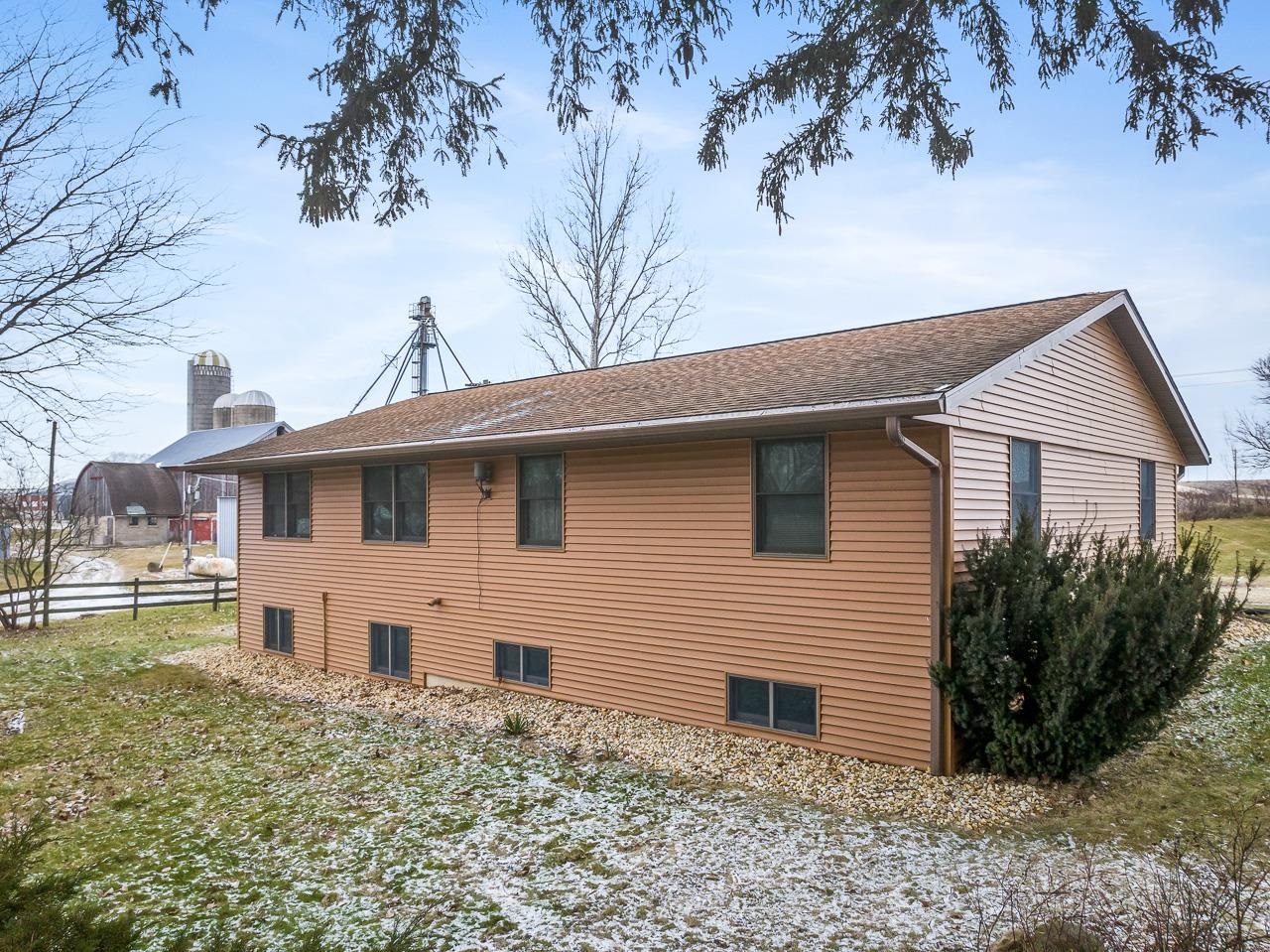 3178 North Berlin School Road Ridott, IL 61067 - Photo 3 of 47 a front view of a house with garden