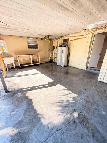 a view of a parking space in back of a garage