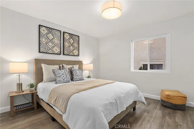 a bedroom with a bed and a couch