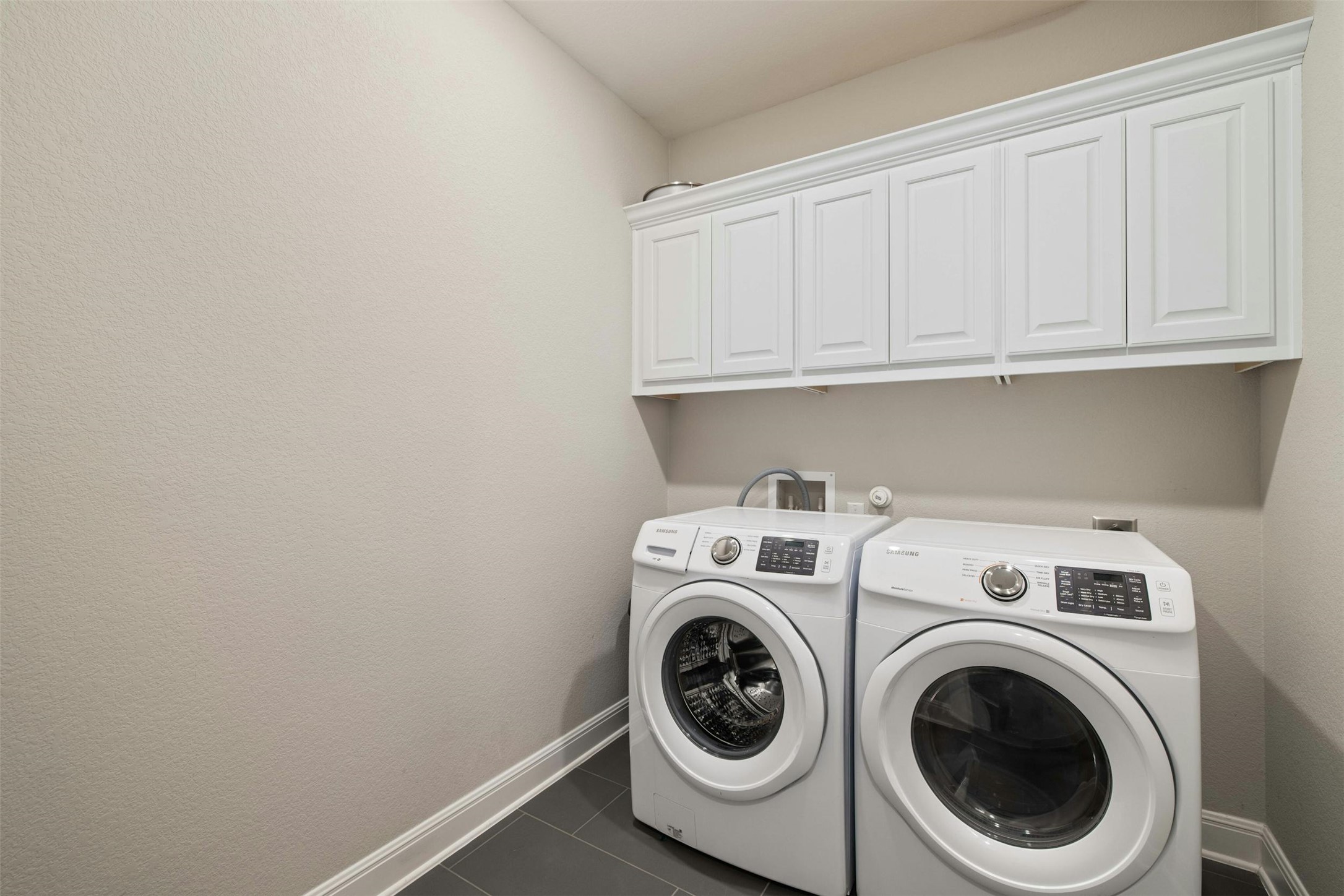 1820 Ficuzza Way Leander, TX 78641 - Photo 23 of 35 The laundry room is efficiently
designed with ample storage
space and convenient access,
making laundry chores a breeze.