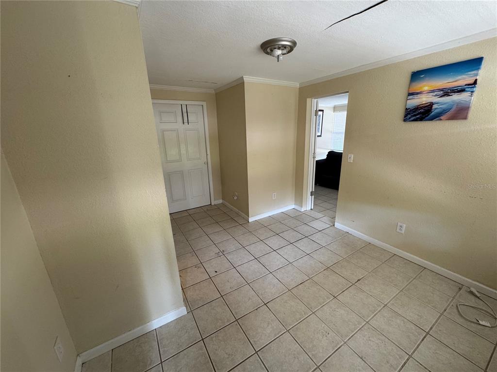 104 Base Avenue West, Unit E Venice, FL 34285 - Photo 2 of 7 a view of an empty room and window