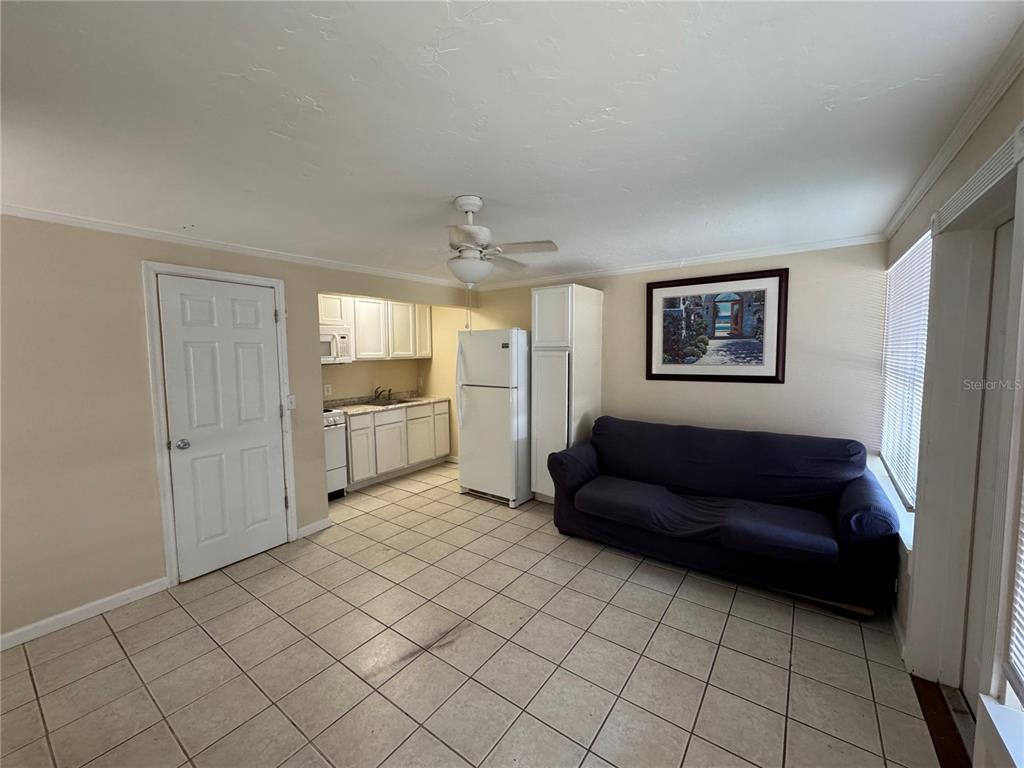 104 Base Avenue West, Unit E Venice, FL 34285 - Photo 7 of 7 a living room with furniture and a window