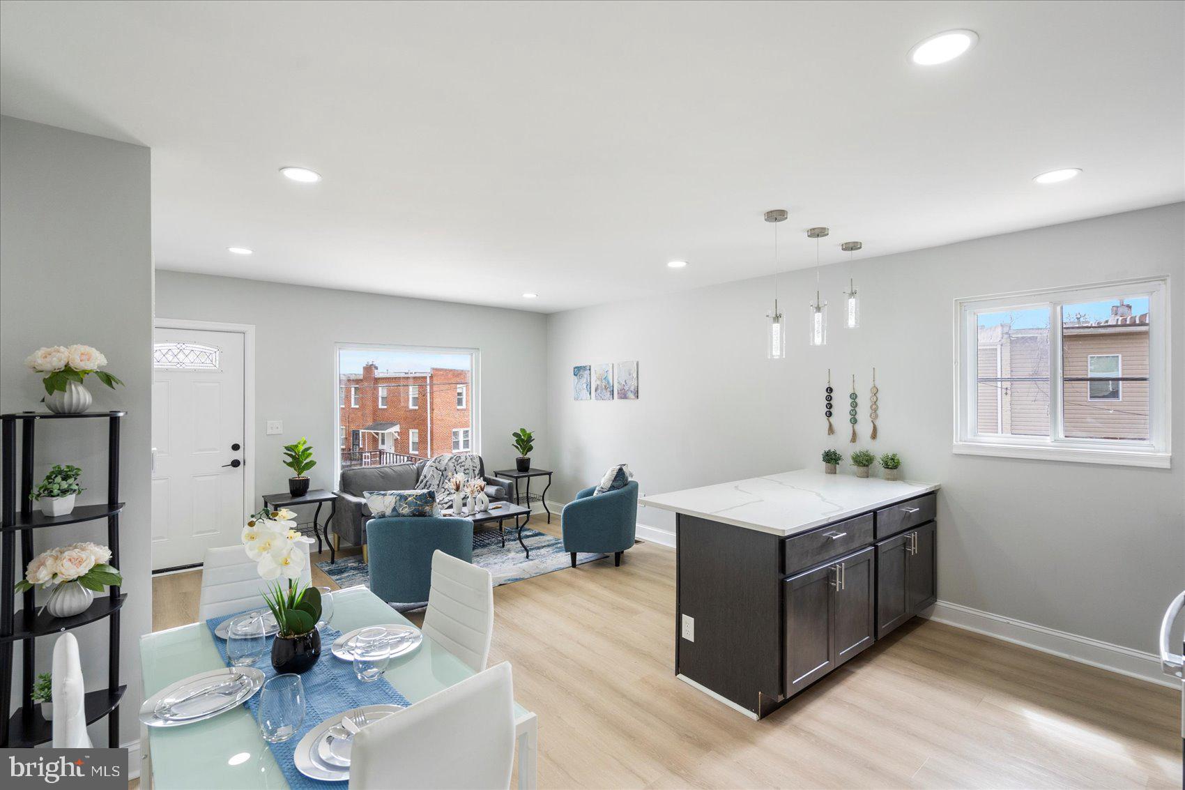 4002 Derby Manor Drive Baltimore, MD 21215 - Photo 11 of 32 a living room with stainless steel appliances furniture a rug and a view