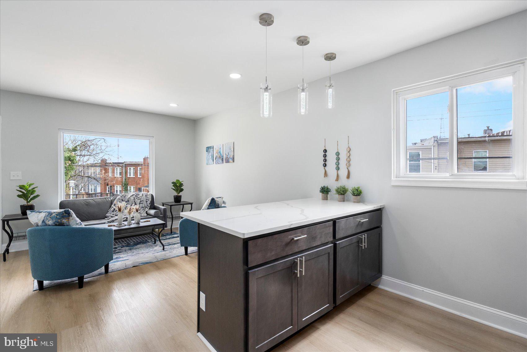 4002 Derby Manor Drive Baltimore, MD 21215 - Photo 12 of 32 a living room with furniture and a wooden floor