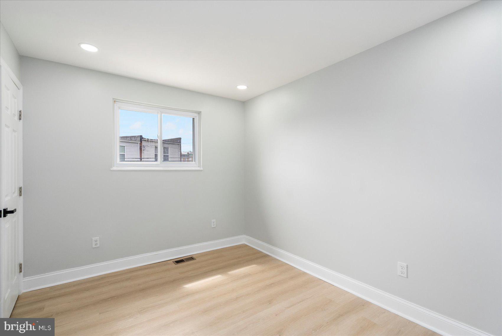 4002 Derby Manor Drive Baltimore, MD 21215 - Photo 14 of 32 an empty room with a window