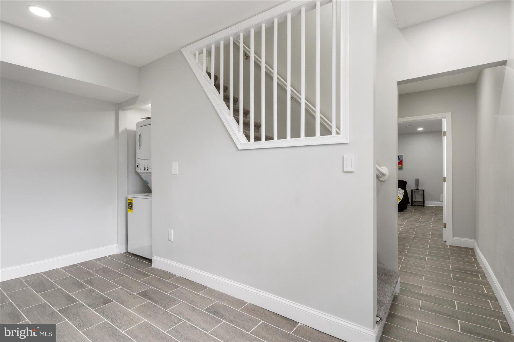 4002 Derby Manor Drive Baltimore, MD 21215 - Photo 20 of 32 a view of a hallway with wooden floor and staircase