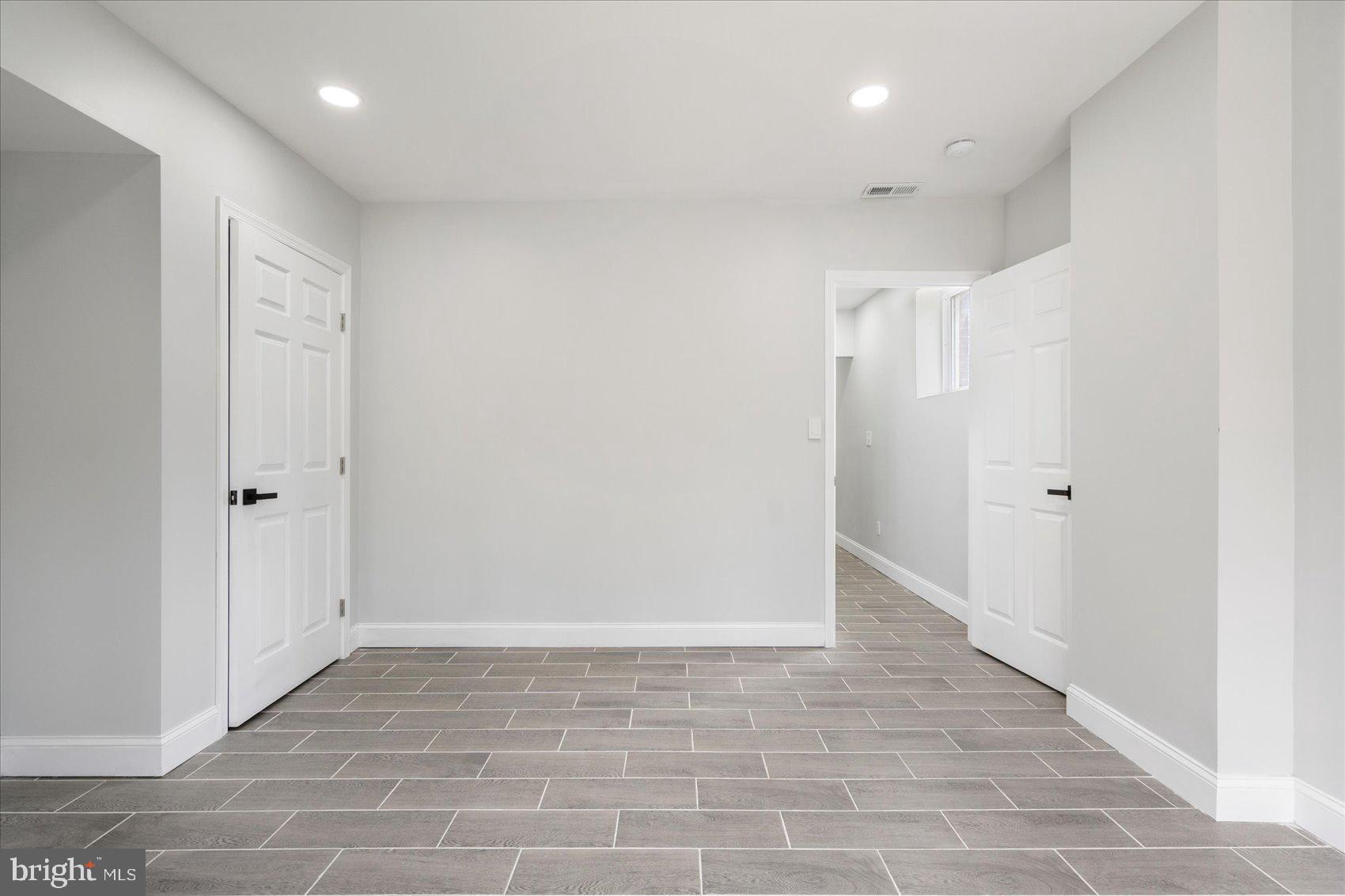 4002 Derby Manor Drive Baltimore, MD 21215 - Photo 22 of 32 a view of hallway with a rug and a shower