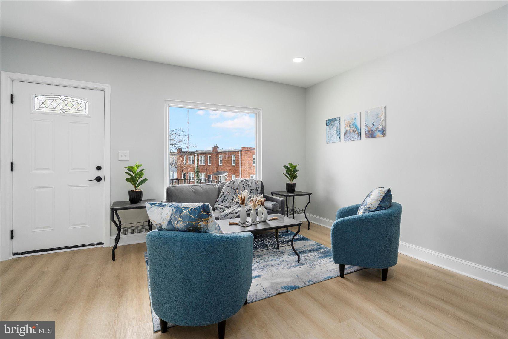 4002 Derby Manor Drive Baltimore, MD 21215 - Photo 6 of 32 a living room with furniture and wooden floor