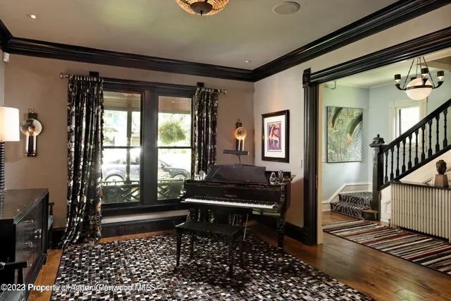 a living room with furniture and a rug