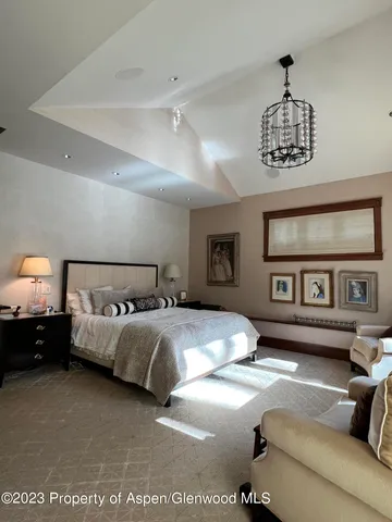 a bedroom with bed and window