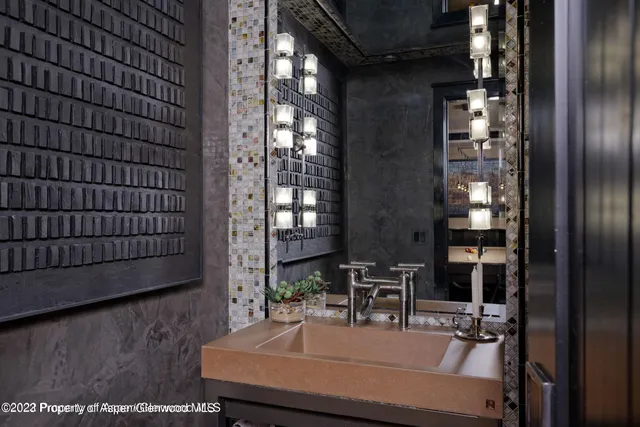 a bedroom with a bed and a flat screen tv on dresser