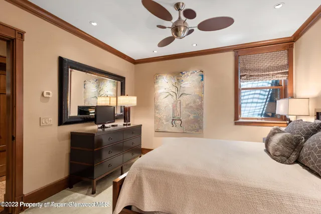 a bathroom with a granite countertop sink toilet a mirror and shower