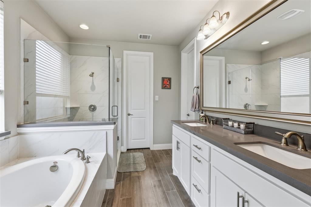 6212 Leatherstem Road Flower Mound, TX 76226 - Photo 13 of 40 Beautiful primary bathroom with double sinks.