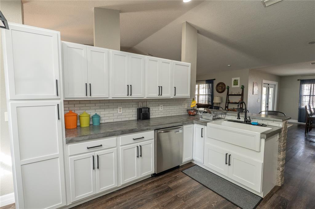 6 Fir Drive Trace Ocala, FL 34472 - Photo 12 of 41 a kitchen with white cabinets and white appliances