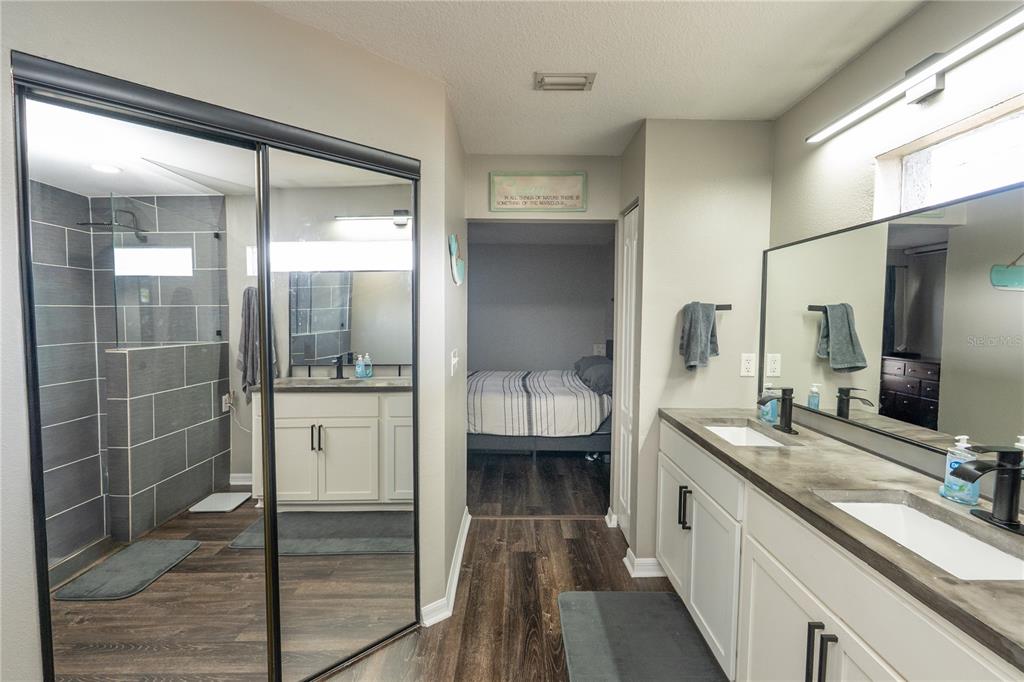 6 Fir Drive Trace Ocala, FL 34472 - Photo 14 of 41 a bathroom with a granite countertop sink mirror and shower