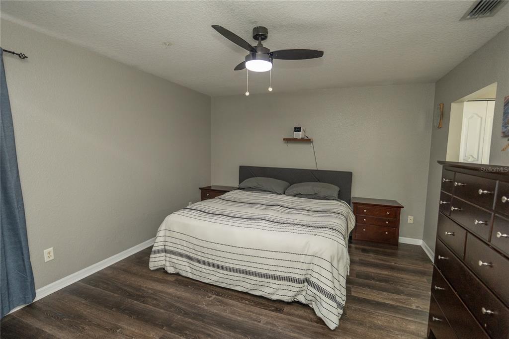 6 Fir Drive Trace Ocala, FL 34472 - Photo 16 of 41 a bedroom with a bed and a ceiling fan