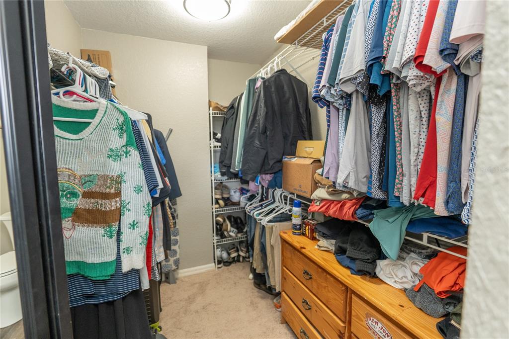 6 Fir Drive Trace Ocala, FL 34472 - Photo 17 of 41 a view of walk in closet with clothes and shoes