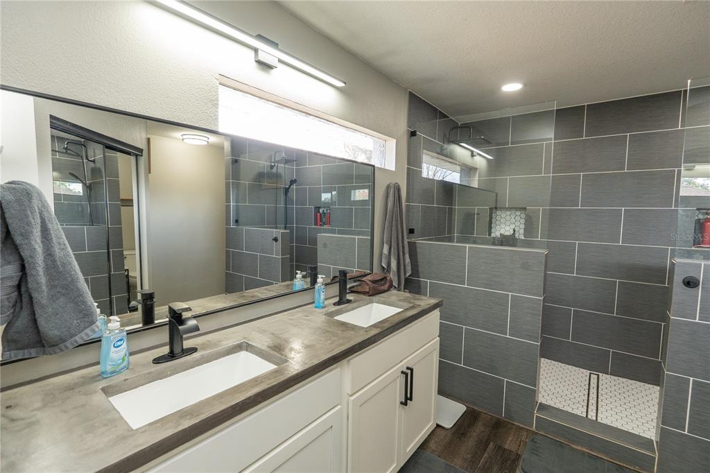 6 Fir Drive Trace Ocala, FL 34472 - Photo 18 of 41 a bathroom with a double vanity sink and a mirror