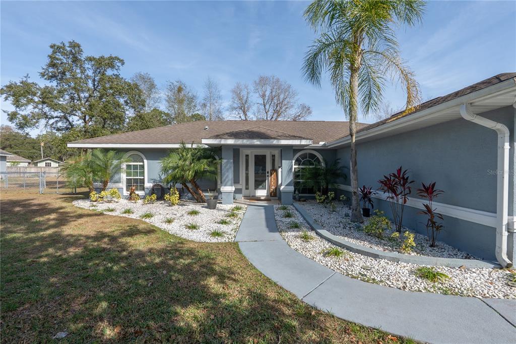 6 Fir Drive Trace Ocala, FL 34472 - Photo 2 of 41 a view of a house with backyard porch and sitting area