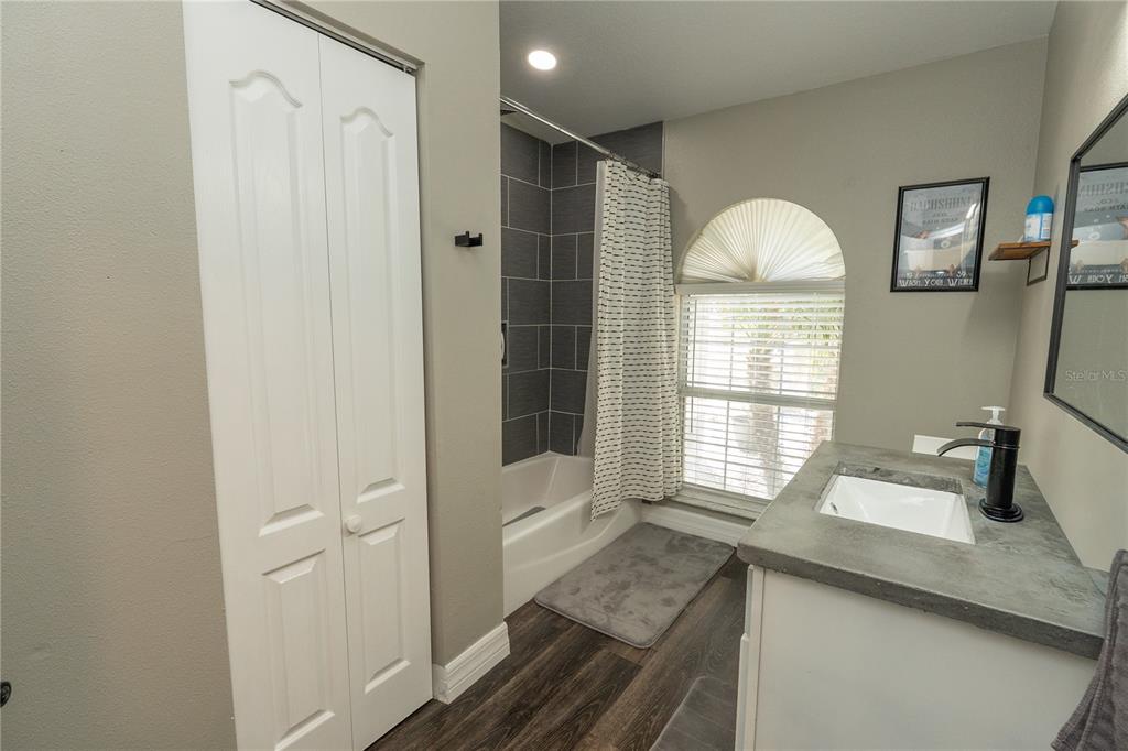6 Fir Drive Trace Ocala, FL 34472 - Photo 24 of 41 a en suite bathroom with a sink a mirror and a shower