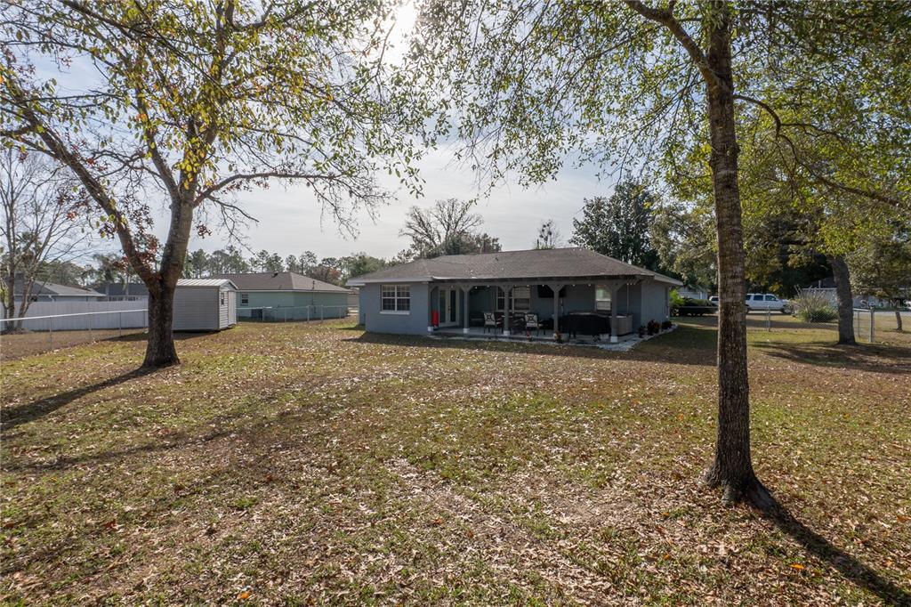 6 Fir Drive Trace Ocala, FL 34472 - Photo 35 of 41 a front view of a house with a yard