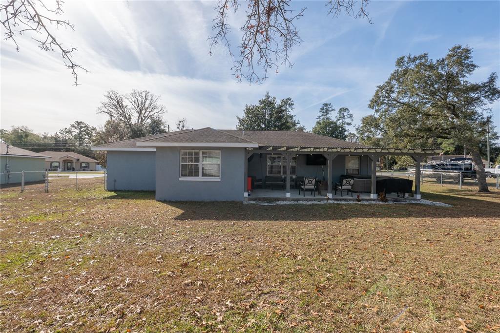 6 Fir Drive Trace Ocala, FL 34472 - Photo 36 of 41 front view of a house with a yard