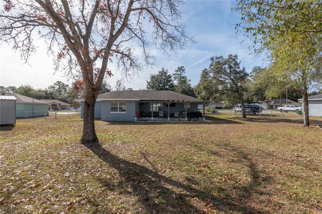 6 Fir Drive Trace Ocala, FL 34472 - Photo 38 of 41 a house with trees in the background