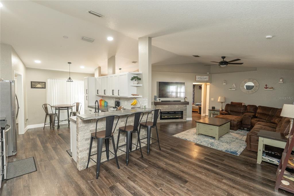 6 Fir Drive Trace Ocala, FL 34472 - Photo 8 of 41 a living room with furniture dining table and wooden floor