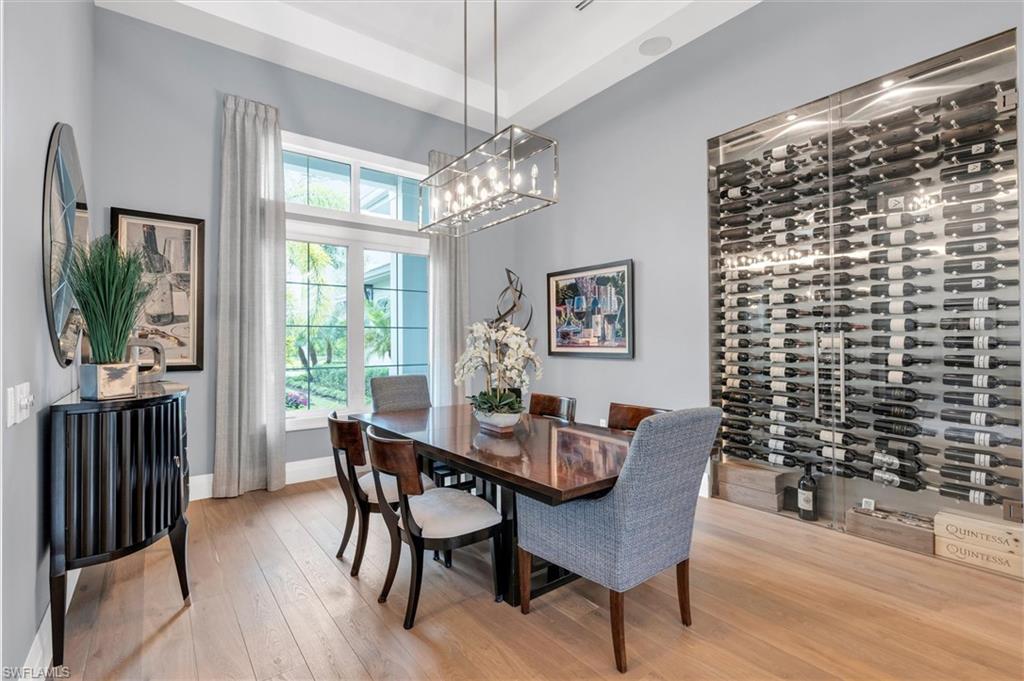 627 Hickory Road Naples, FL 34108 - Photo 13 of 36 Formal Dining Room and Wine Wall