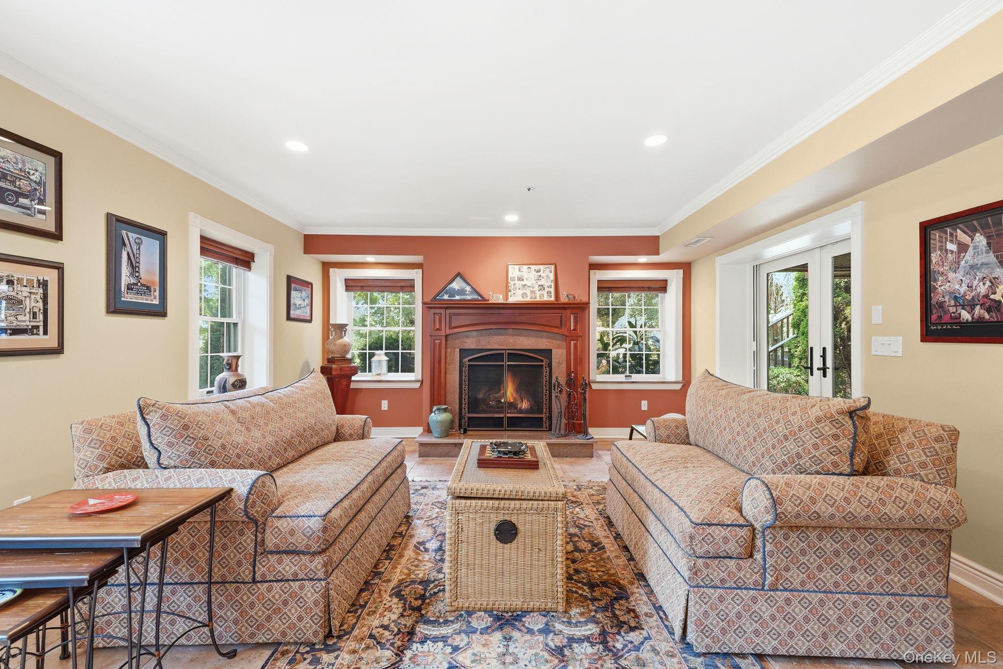 33 Hevelyne Road Elmsford, NY 10523 - Photo 32 of 43 Family room with gas fireplace in terrace level with Bar and walk-out access to patio.