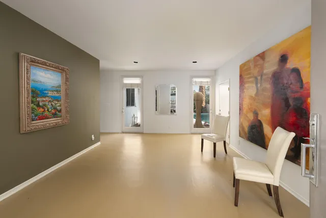 a view of a livingroom with furniture and windows