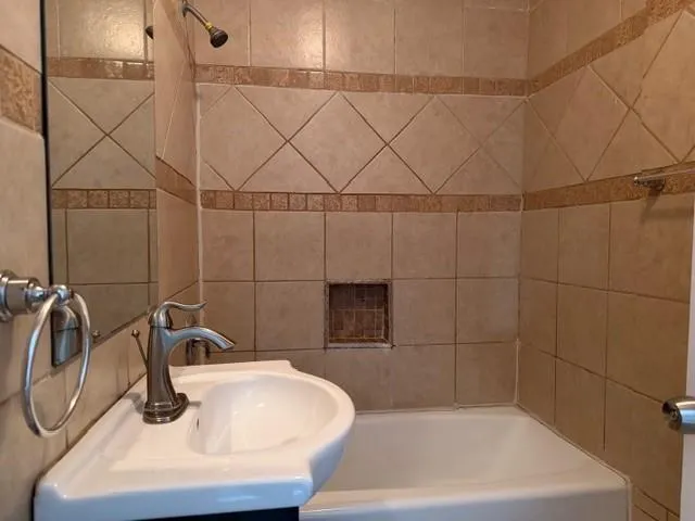 a bathroom with a sink and a shower