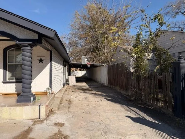 a view of a house with a snow in the yard
