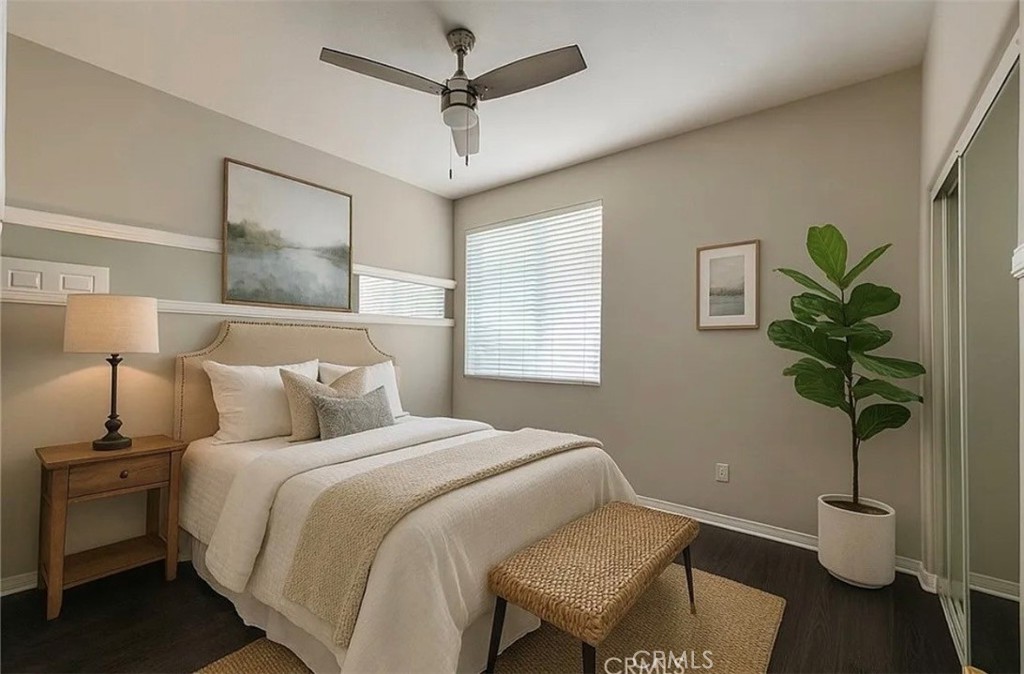 3715 Club Rancho Drive Palmdale, CA 93551 - Photo 17 of 52 a bedroom with a bed and a potted plant