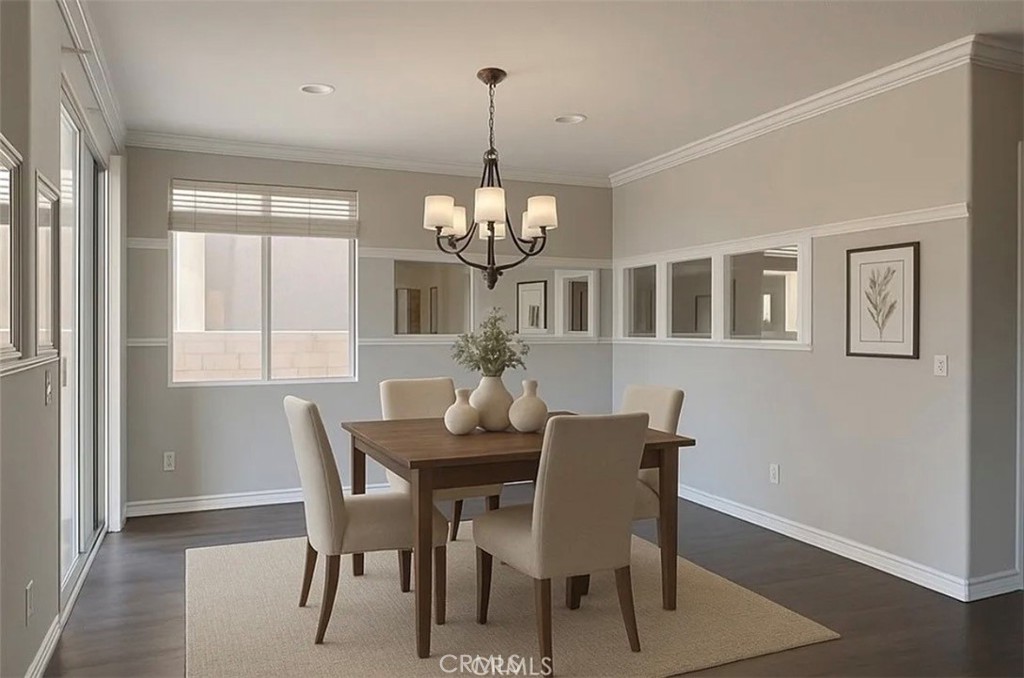 3715 Club Rancho Drive Palmdale, CA 93551 - Photo 20 of 52 a dining room with wooden floor a chandelier a wooden table and chairs