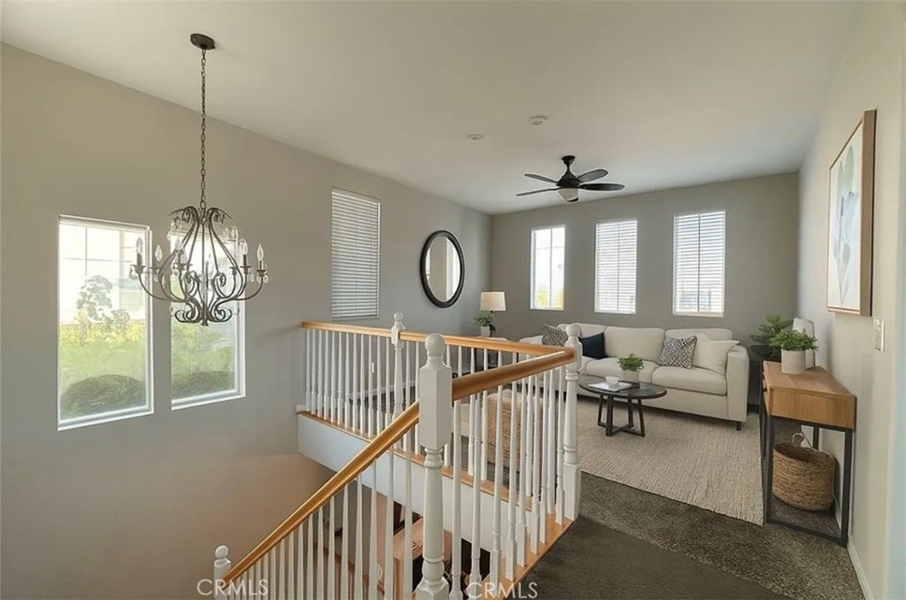 3715 Club Rancho Drive Palmdale, CA 93551 - Photo 22 of 52 a living room with furniture chandelier and a large window