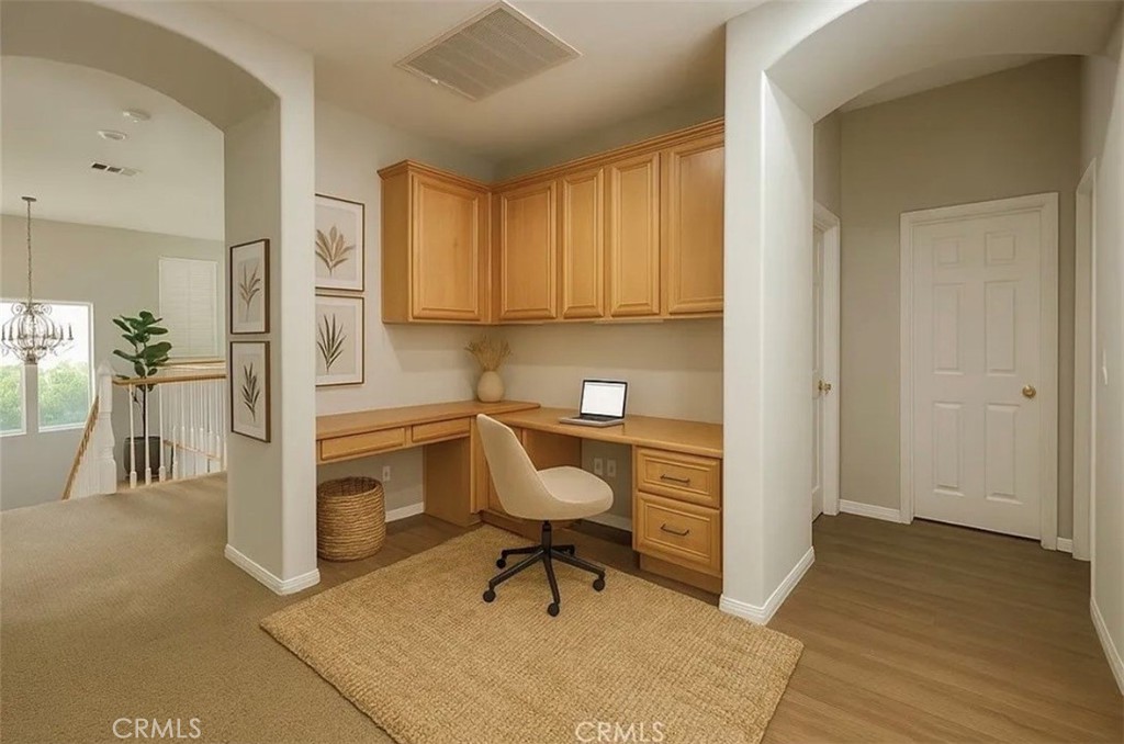 3715 Club Rancho Drive Palmdale, CA 93551 - Photo 24 of 52 a view of a livingroom with furniture and a hallway